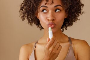Lip balm being applied to the lips