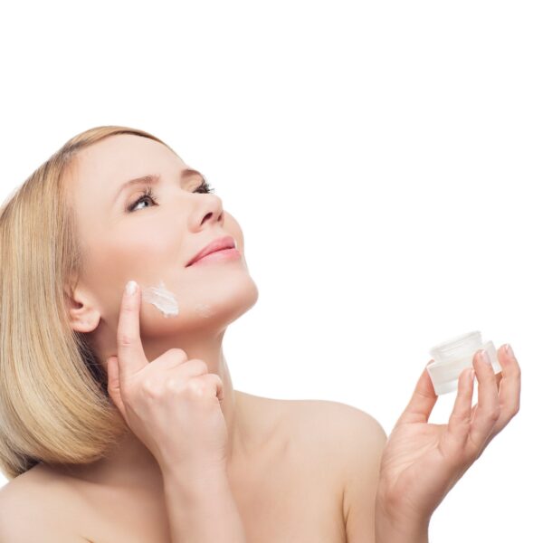 Moisturiser being smoothed along the jawline and neck